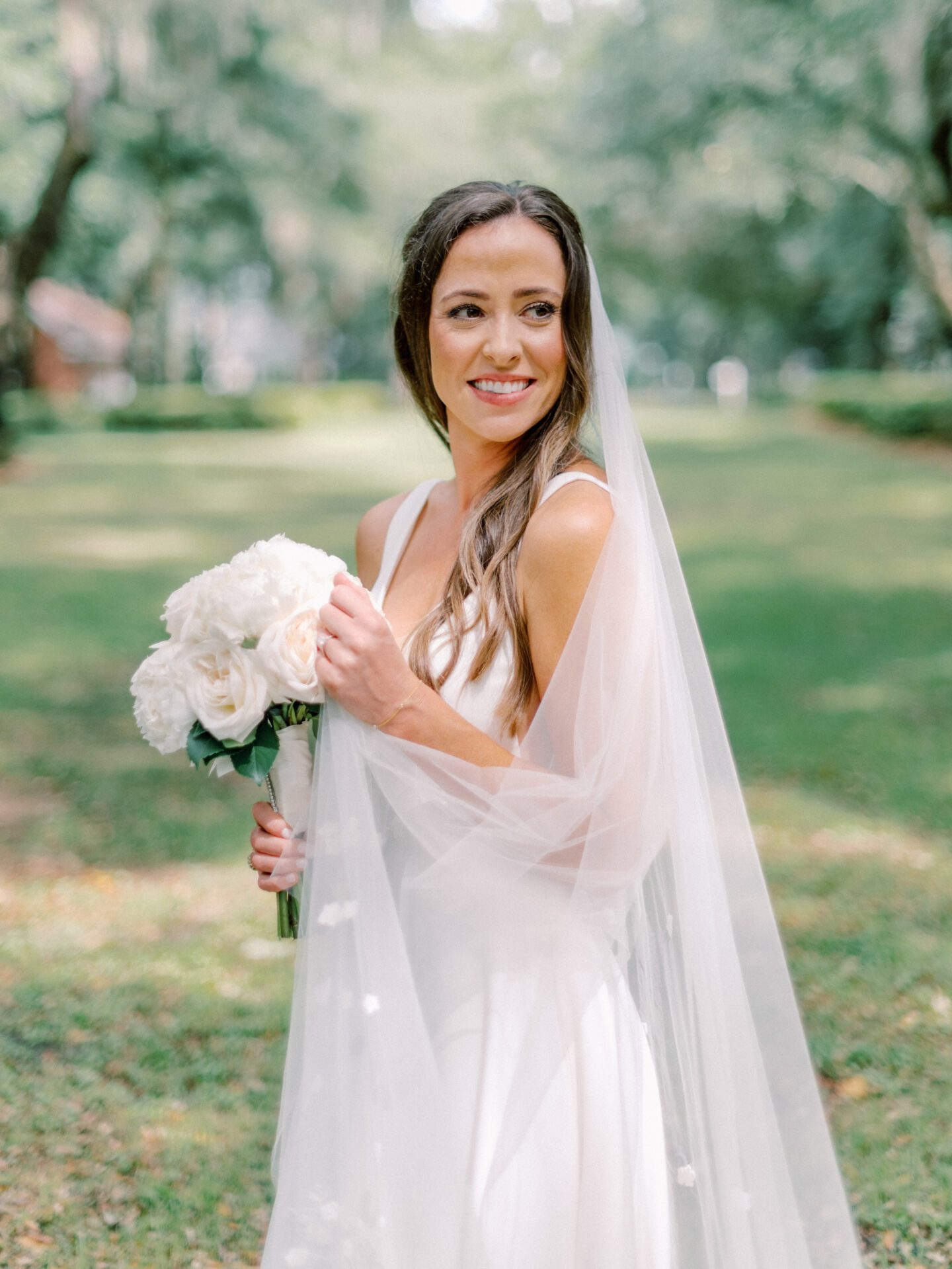 a bride holding a bouquet of flowers